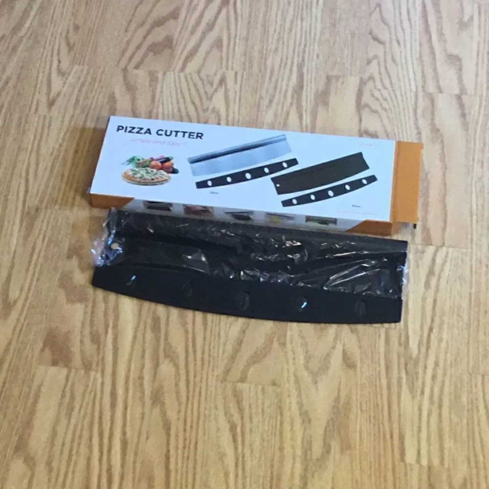New stock, black pizza cutters with blade cover
